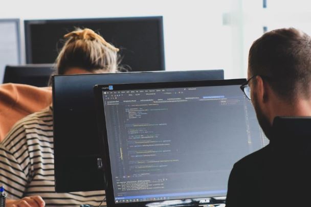 Man typing, coding in the system