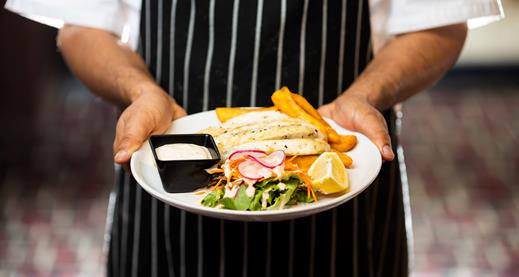Hospitality and Tourism Management with Co-op Chef presenting prepared dishes
