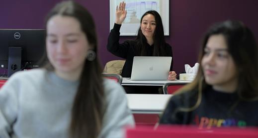 Diploma in Cybersecurity Analyst Practicum Woman raising hand to ask