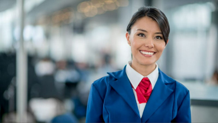 Woman smiling, Hostess with uniform, posing for photo