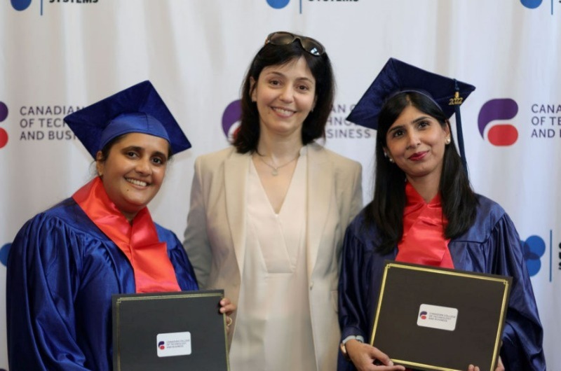 Course completion students posing with certificates, smiling