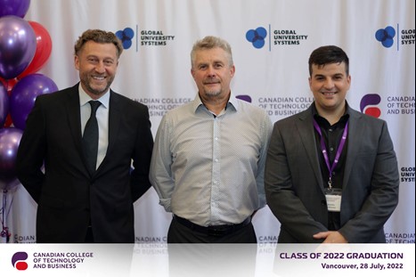 Leadership team smiling, posing for a photograph