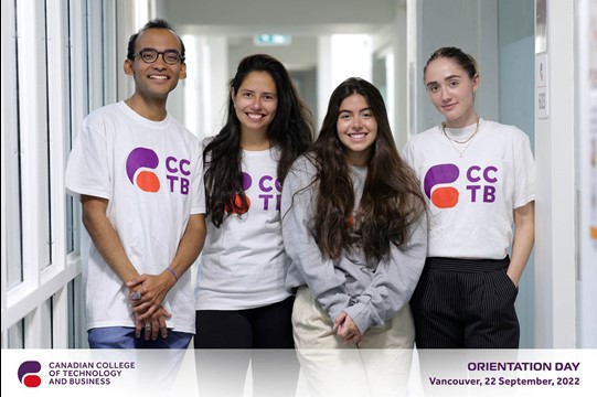 Group smiling, standing and posing for a photograph