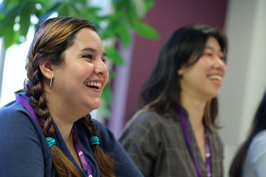 Two Women smiling, posing for photo