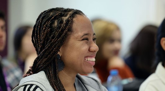 Woman smiling, posing for photo