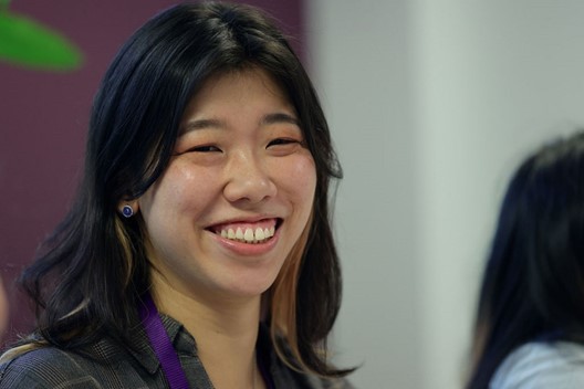 Woman smiling, posing for photo