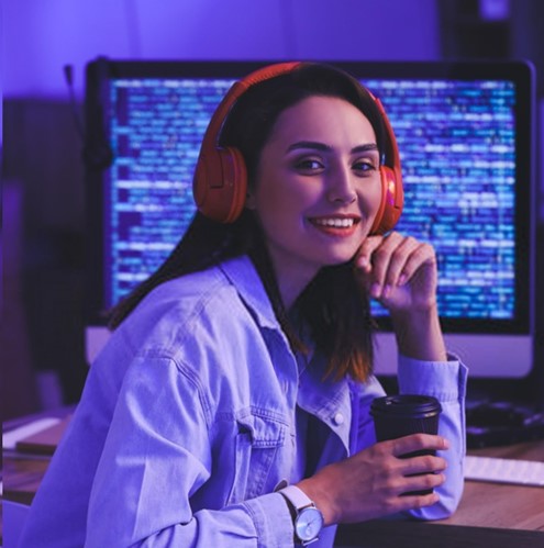 
Woman smiling, wearing headset, posing for photo