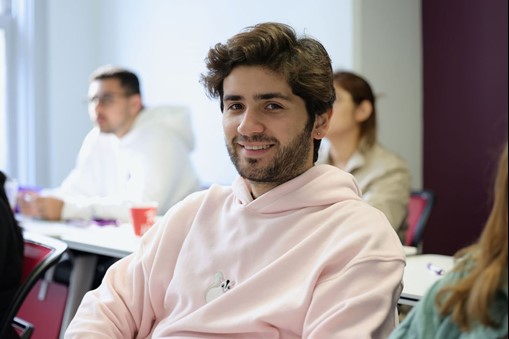 Man smiling, posing for photo