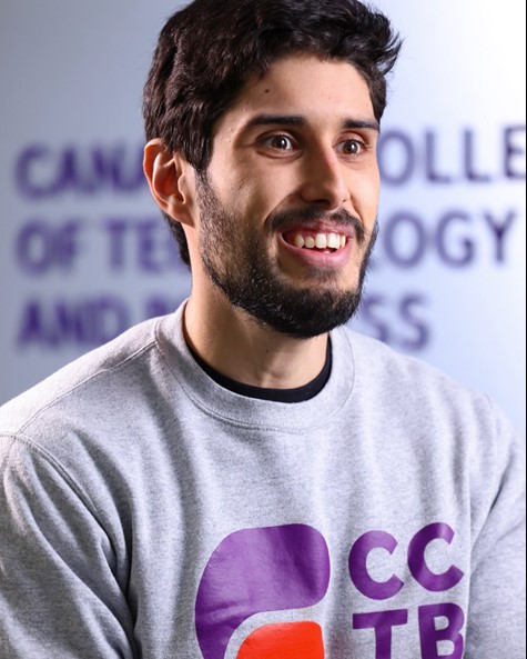 Man smiling, posing for photo
