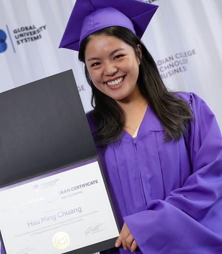 Woman smiling, Convocation ceremony, posing for photo