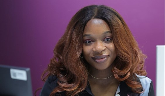 Woman smiling, posing for photo