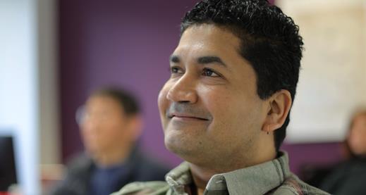 EAP (English for Academic Purposes) Man posing, smiling