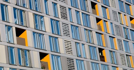 Glass door building with windows and balcony