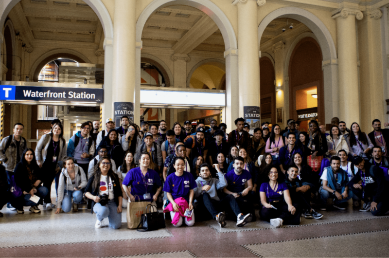Waterfront Station - Group of individuals smiling, posing for a photograph