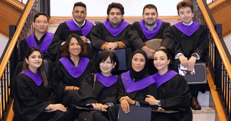 Group smiles, graduation ceremony, posing for a photograph sitting
