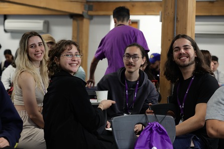 Group smiling, wearing ID card, Posing for a photo