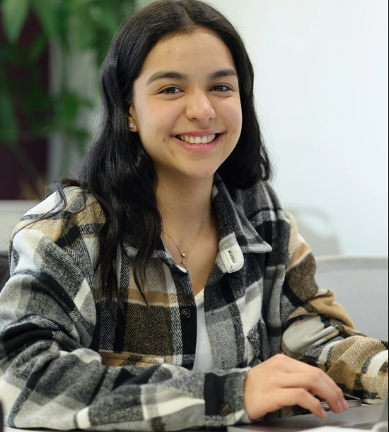 Woman smiling, posing for a photo