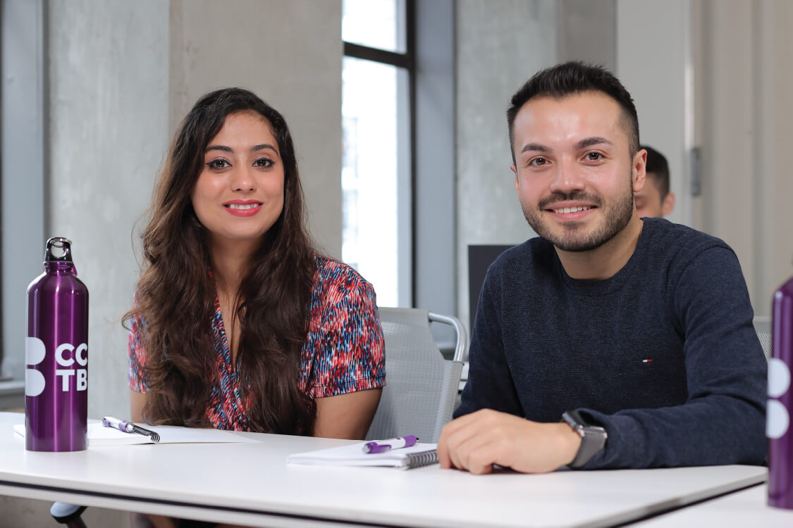 Students smiling and posing for a photo