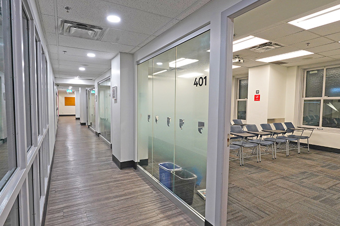Hallway with glass-walled classroom